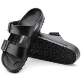 Black EVA sandal, two straps with buckles on top. Birkenstock printed inside.