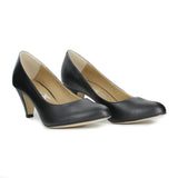 A simple black vegan leather pump with a small covered heel. Almond toe shape. Beige lining.