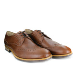 A tan vegan leather brogue dress shoe, lace up with 3 eyelets. Tan and dark brown sole with rubber grip for traction.
